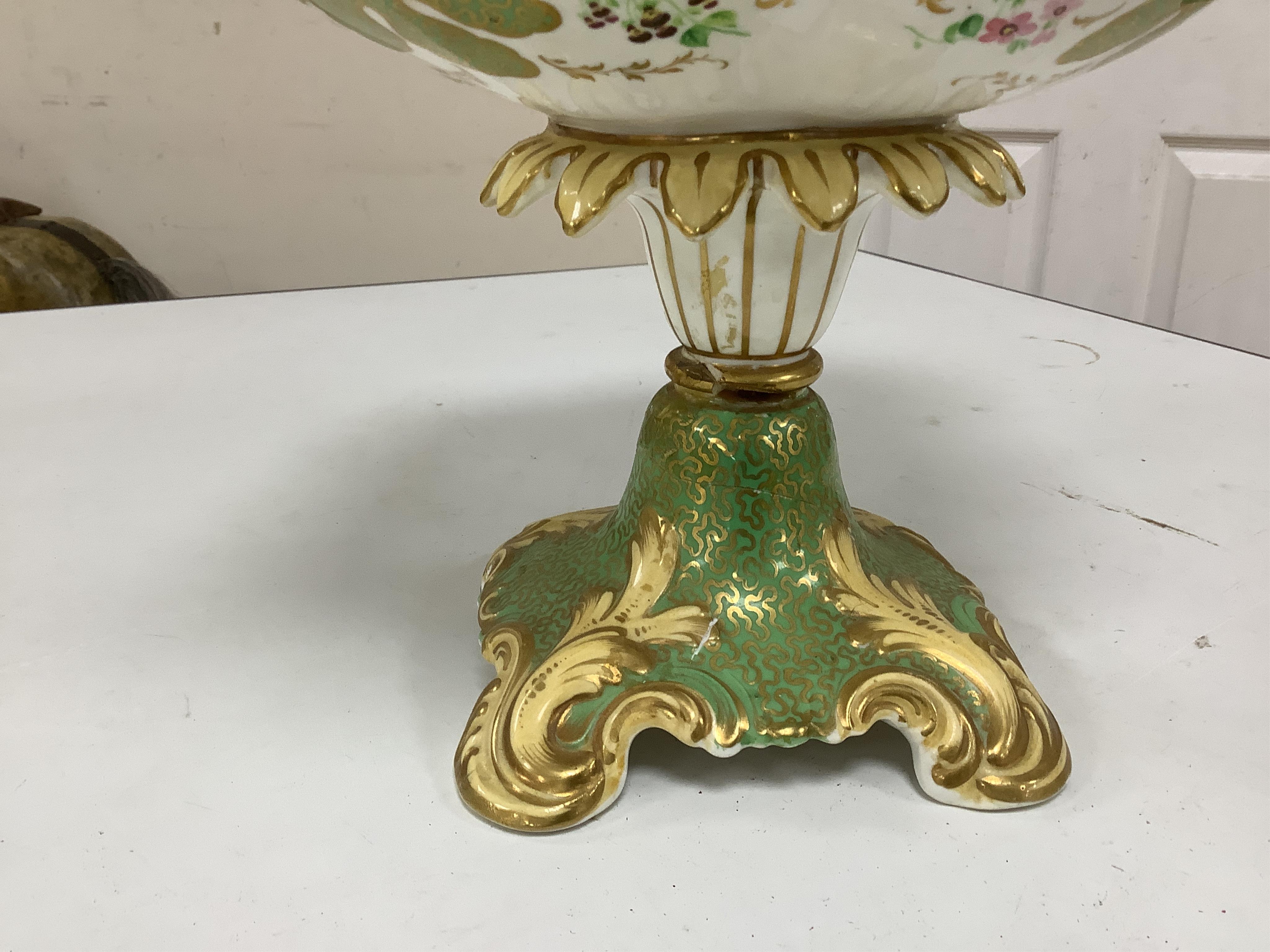 A circa 1835 part dessert set of floral and gilt decorated Rockingham style china, pattern number 6626, centrepiece 34cm wide. Condition - small comport cover cracked badly, some wear to gilding and pattern on plates